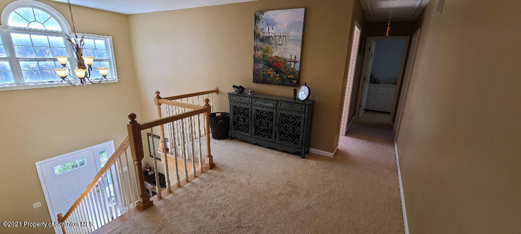 129 Bald Mountain Road Wilkes Barre, PA 18702 - Photo 25 of 40 a view of a hallway with windows