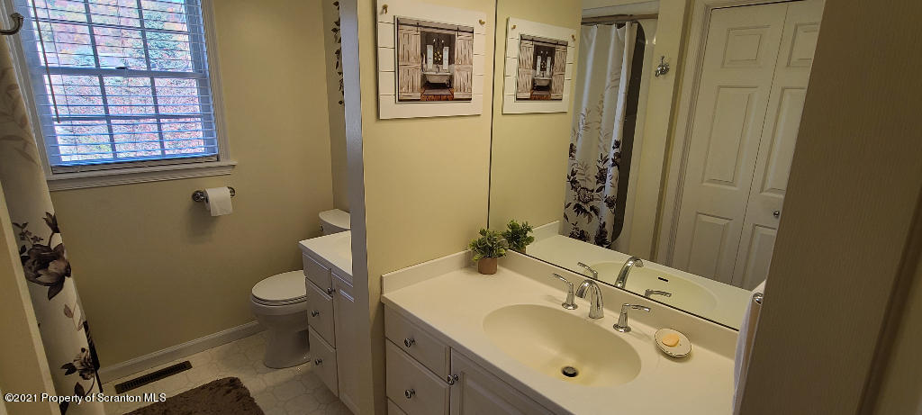 129 Bald Mountain Road Wilkes Barre, PA 18702 - Photo 34 of 40 a bathroom with a sink mirror vanity and toilet