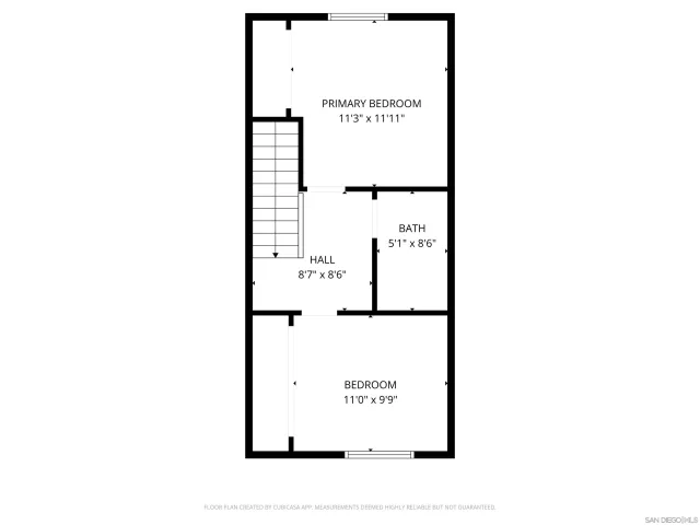 a view of a street sign under a large tree