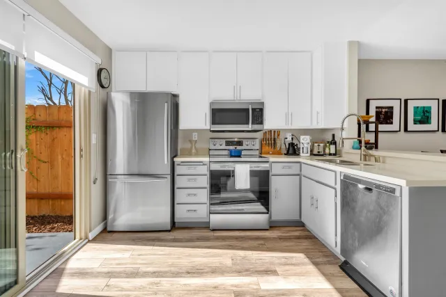 a kitchen with a refrigerator sink and microwave