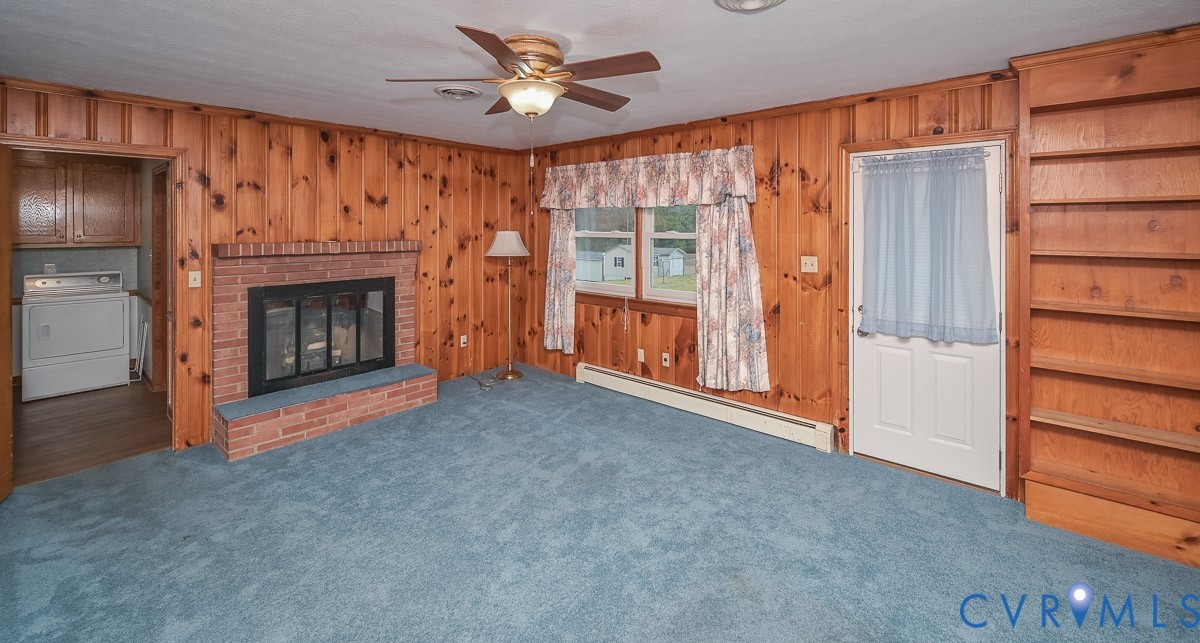 1629 New Market Road Henrico, VA 23231 - Photo 13 of 49 a view of an empty room with a fireplace and a window