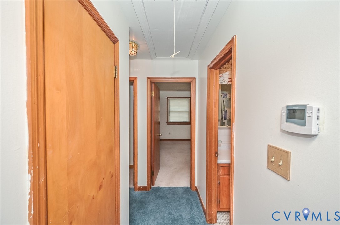 1629 New Market Road Henrico, VA 23231 - Photo 18 of 49 a view of a hallway with wooden shelves