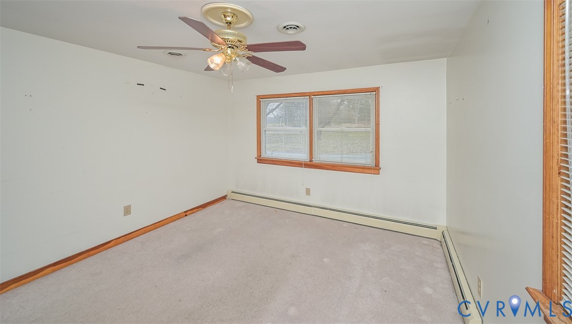1629 New Market Road Henrico, VA 23231 - Photo 20 of 49 an empty room with a window and a fan