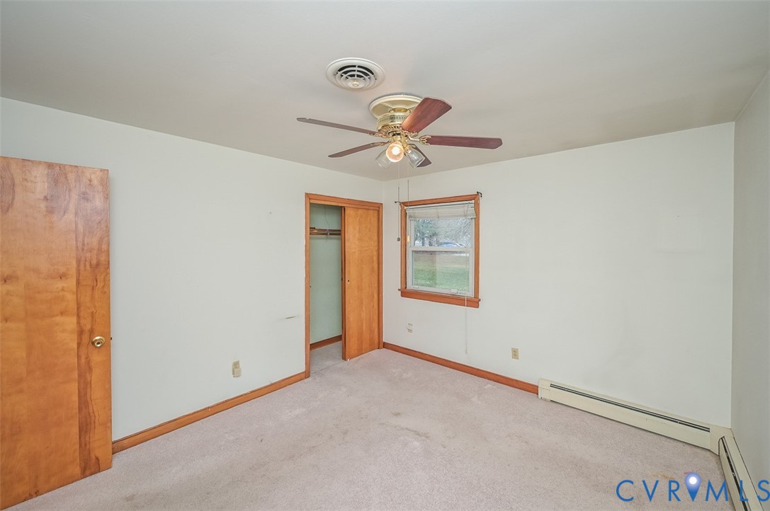 1629 New Market Road Henrico, VA 23231 - Photo 28 of 49 a view of a livingroom with a ceiling fan and window