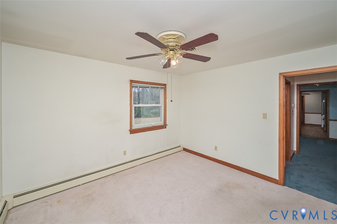 1629 New Market Road Henrico, VA 23231 - Photo 30 of 49 an empty room with a window and a ceiling fan