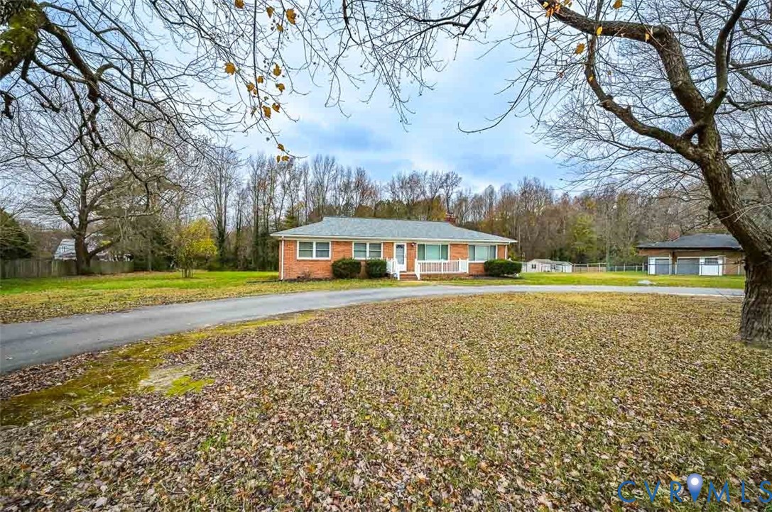 1629 New Market Road Henrico, VA 23231 - Photo 3 of 49 a view of a house with a yard
