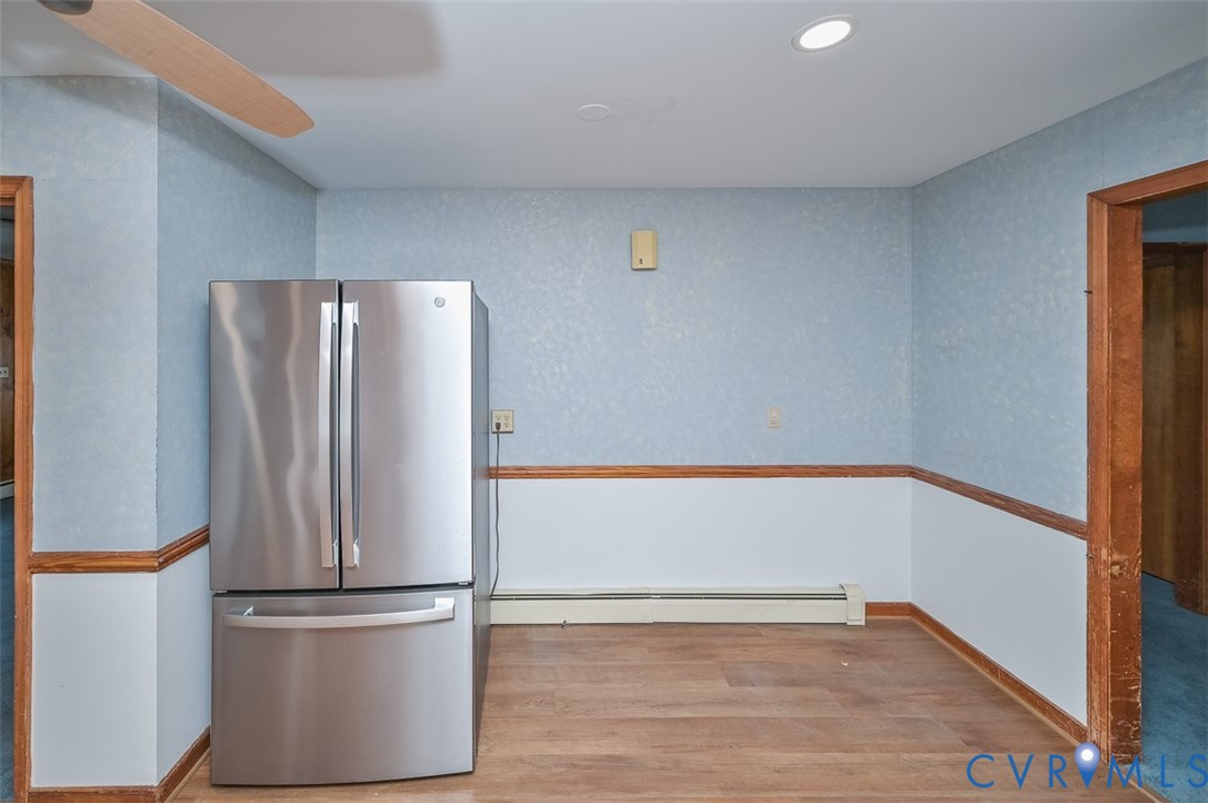 1629 New Market Road Henrico, VA 23231 - Photo 37 of 49 a view of an empty room with wooden floor and a window
