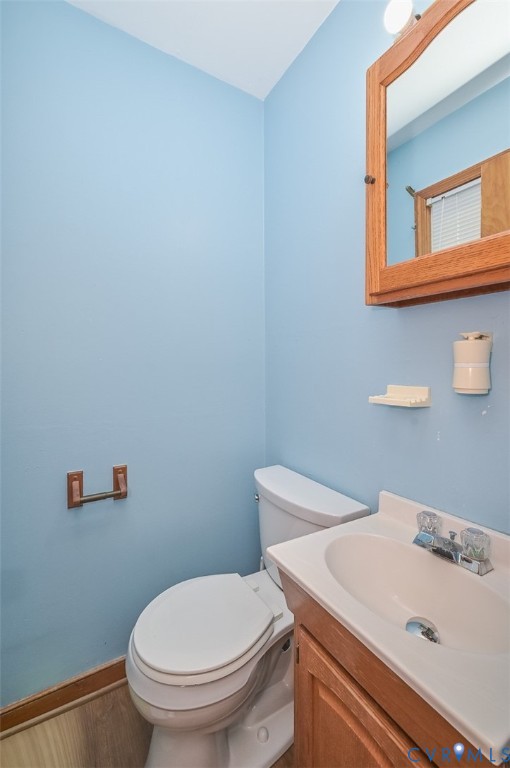 1629 New Market Road Henrico, VA 23231 - Photo 39 of 49 a white toilet sitting next to a bathroom sink
