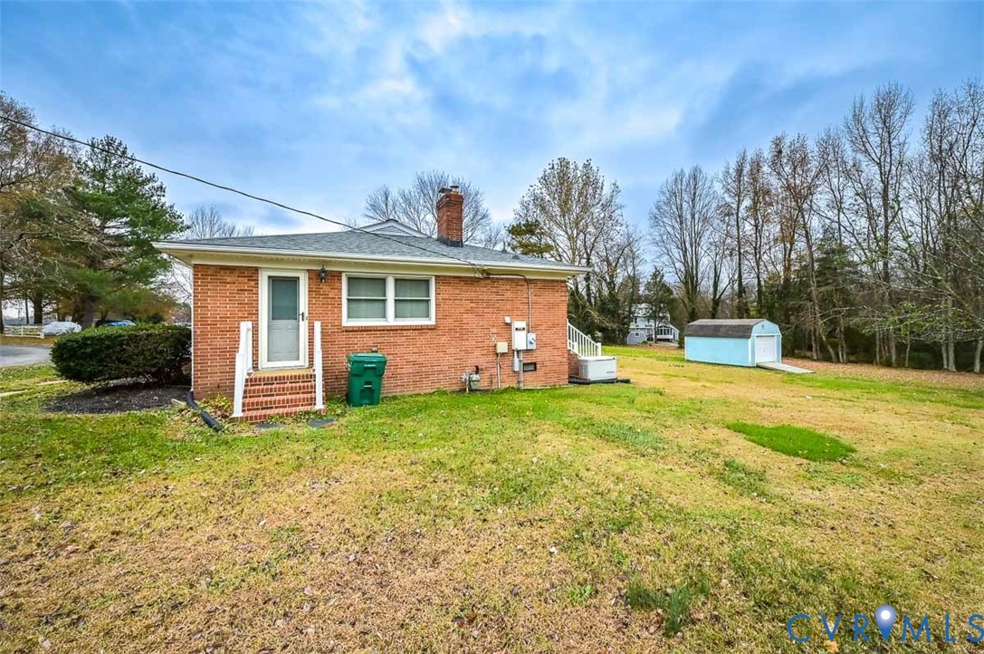 1629 New Market Road Henrico, VA 23231 - Photo 44 of 49 a view of a house with backyard and trees