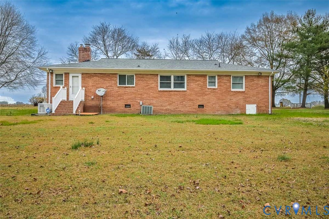 1629 New Market Road Henrico, VA 23231 - Photo 45 of 49 a front view of a house with a yard