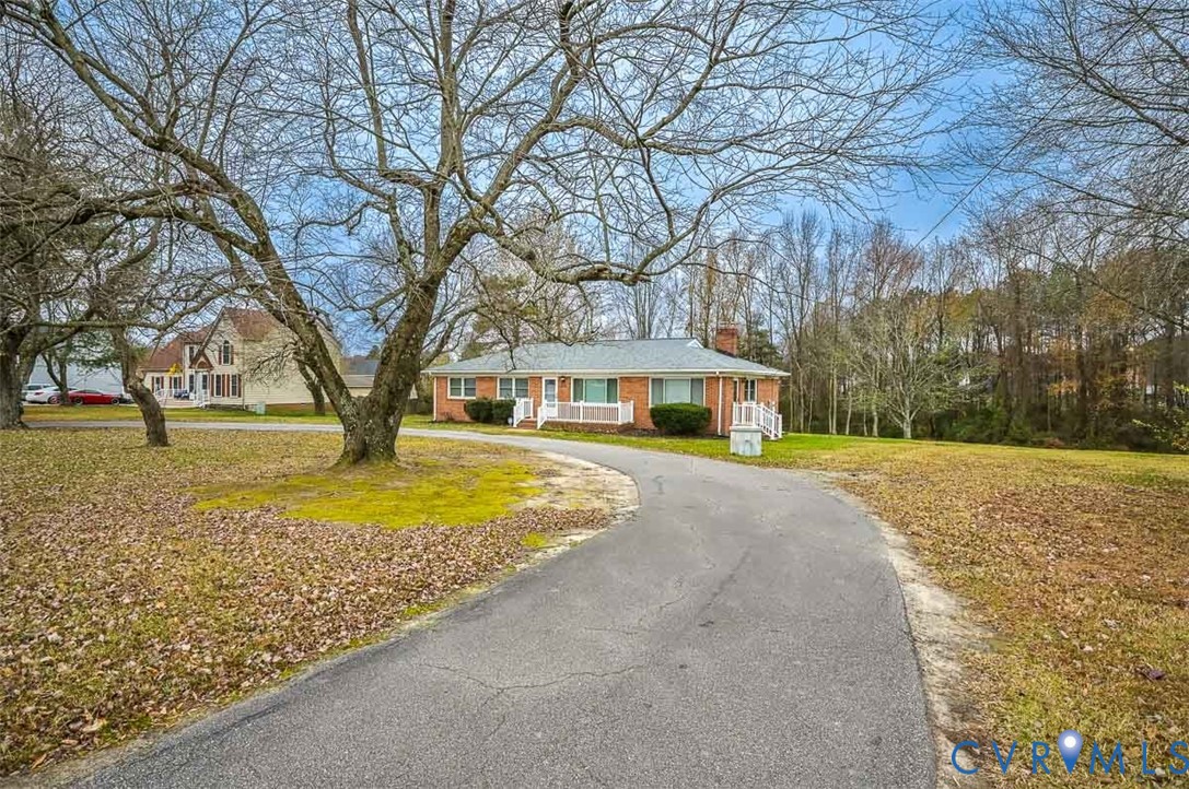 1629 New Market Road Henrico, VA 23231 - Photo 46 of 49 a house with trees in front of it