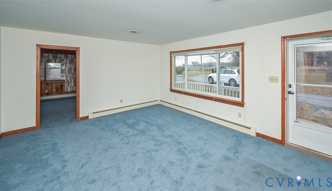 1629 New Market Road Henrico, VA 23231 - Photo 7 of 49 an empty room with windows lake and mountain view