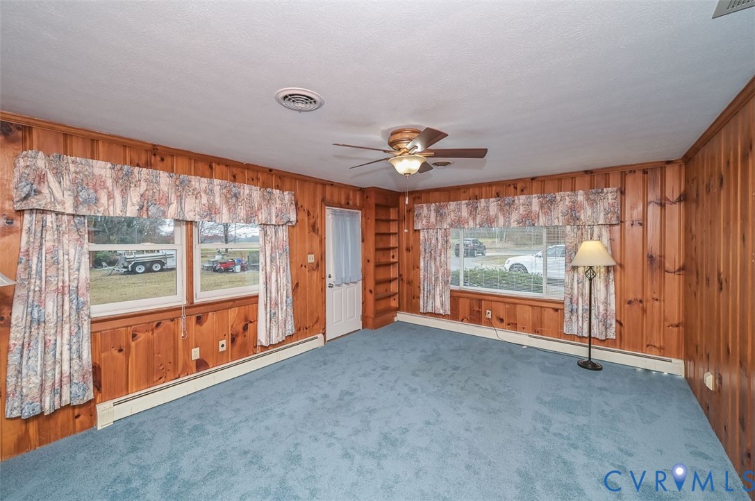 1629 New Market Road Henrico, VA 23231 - Photo 10 of 49 an empty room with large windows