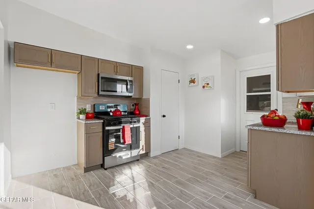 a bed room with a bed and painting on the wall