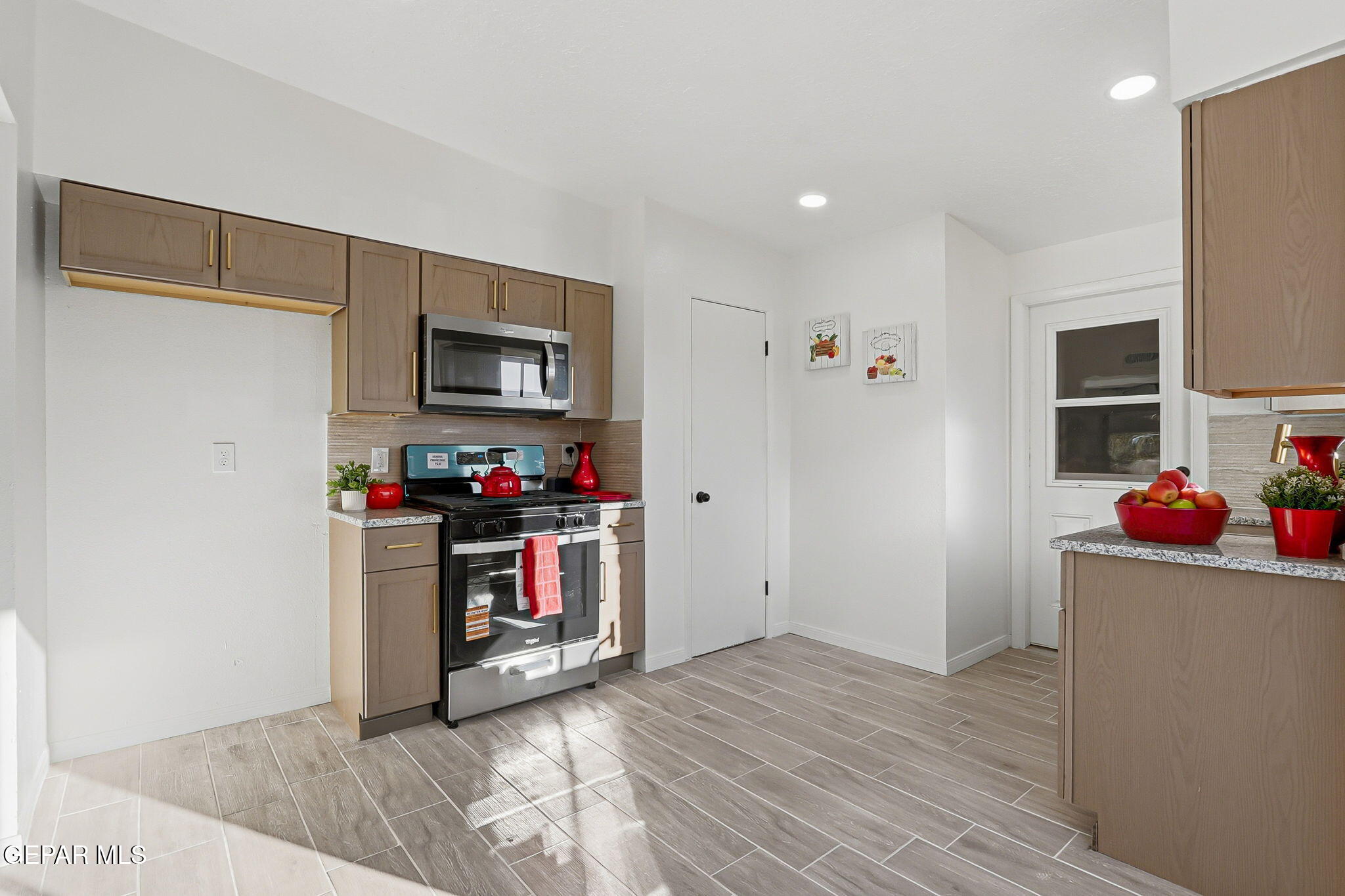 113 West Point Drive El Paso, TX 79907 - Photo 17 of 40 a view of a kitchen with refrigerator and stove