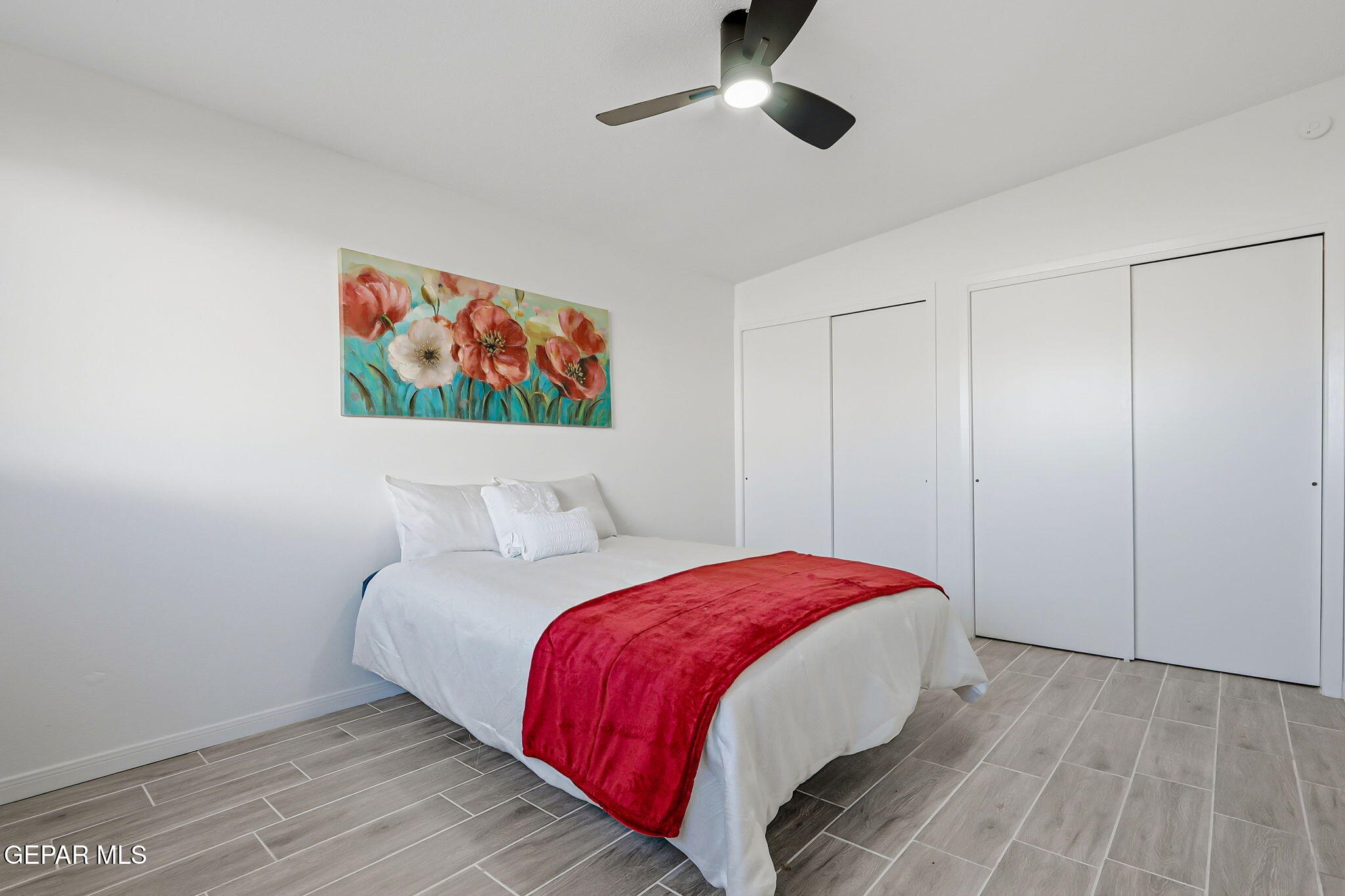 113 West Point Drive El Paso, TX 79907 - Photo 19 of 40 a bed room with a bed and a painting on the wall