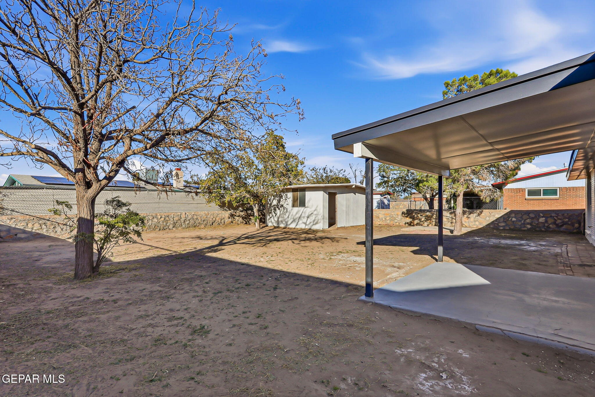 113 West Point Drive El Paso, TX 79907 - Photo 38 of 40 a backyard of a house with table and chairs