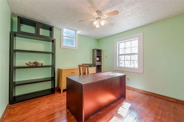 a workspace with furniture and wooden floor