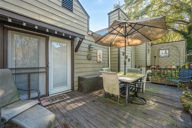 a kitchen with granite countertop a refrigerator and a stove top oven