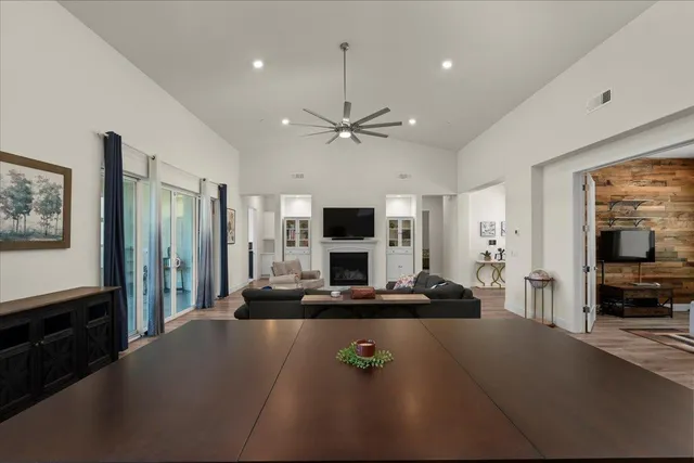 a kitchen with sink cabinets and dining table