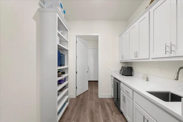 a kitchen with a refrigerator and cabinets
