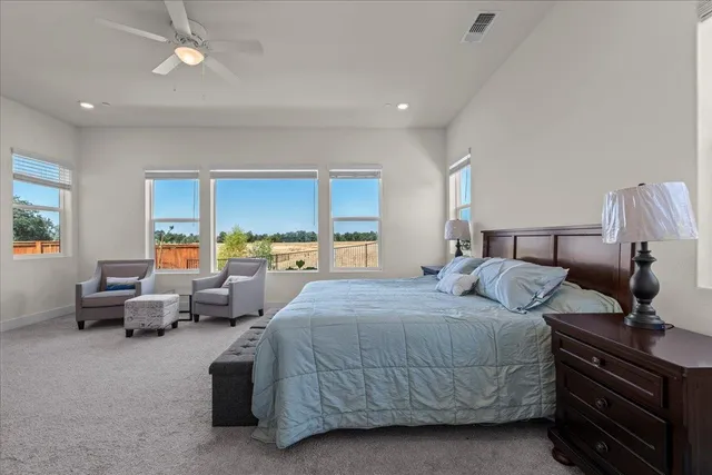 a bedroom with a bed and a mirror