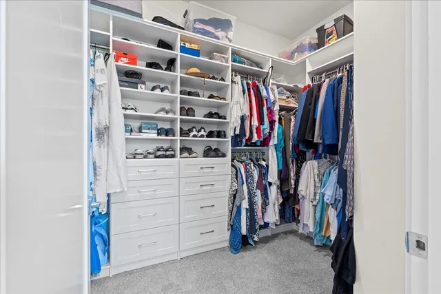 a bedroom with bed and a window