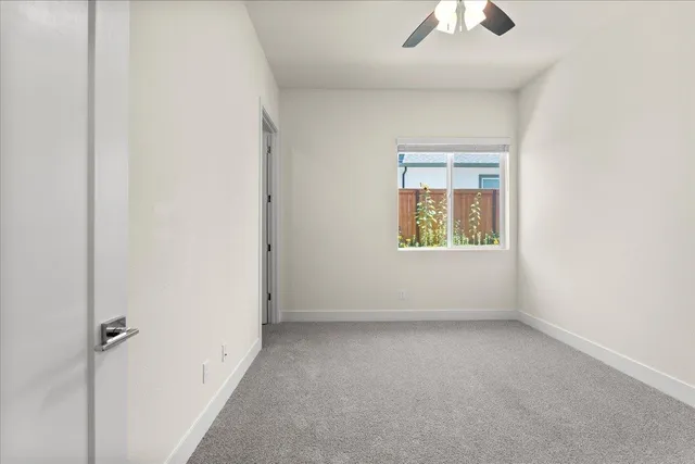 a living room with furniture a rug and a chandelier