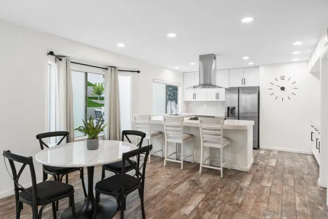 a kitchen with a sink stove and refrigerator