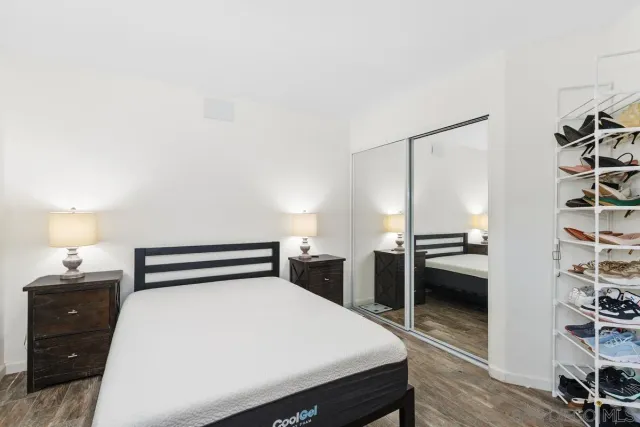 a bedroom with a bed and a chair