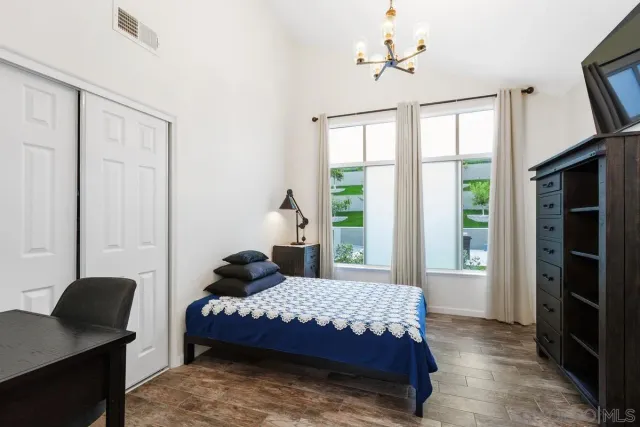 a bedroom with a bed and a table