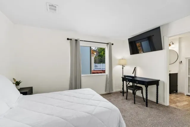 a bathroom with a sink a mirror and a shower