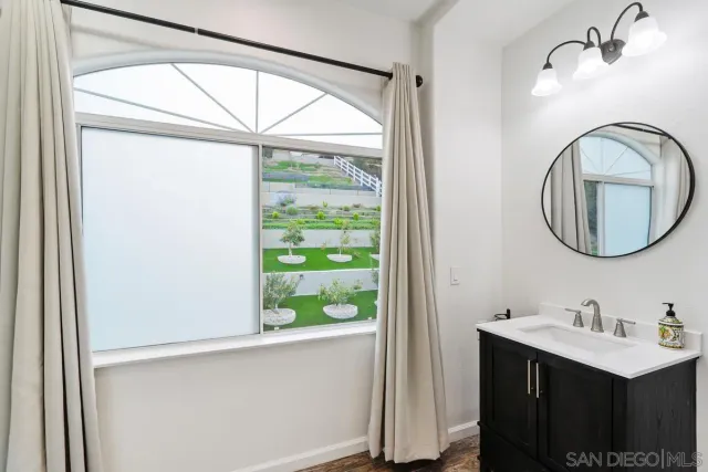 a view of a door and bedroom in a house