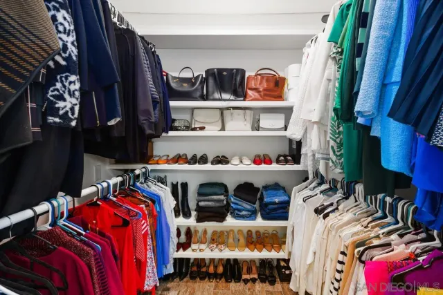 a bedroom with a bed and a table in it