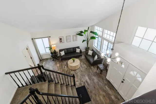 a bedroom with a bed and a television