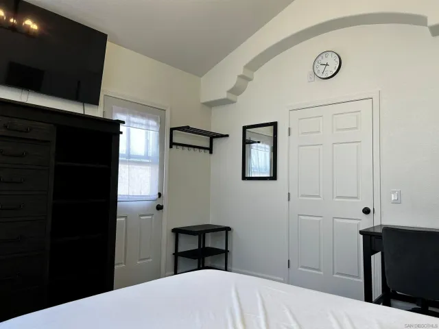 a view of a table and chairs in patio and a yard