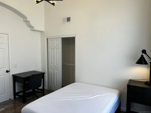 a view of a garden with a house in the background