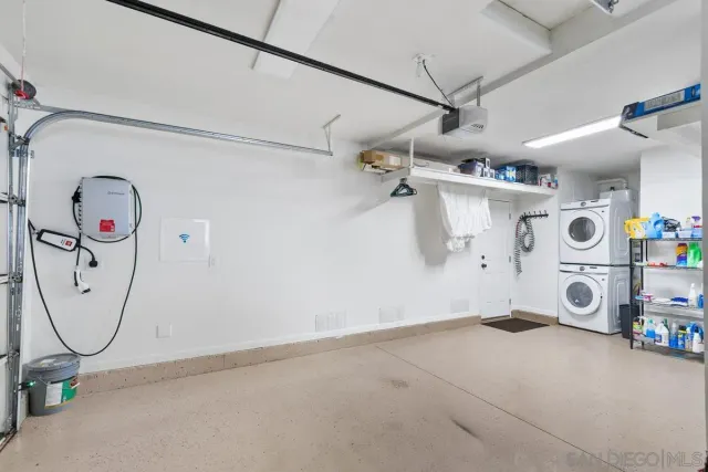 a view of a patio with two chairs and a table