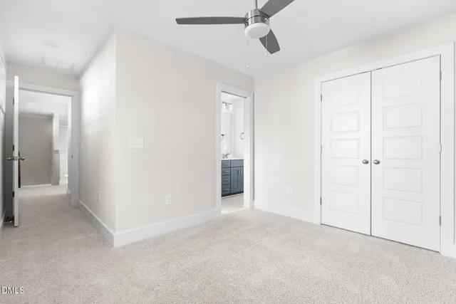 a view of an empty room and closet area