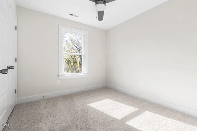 a view of room with window and ceiling fan