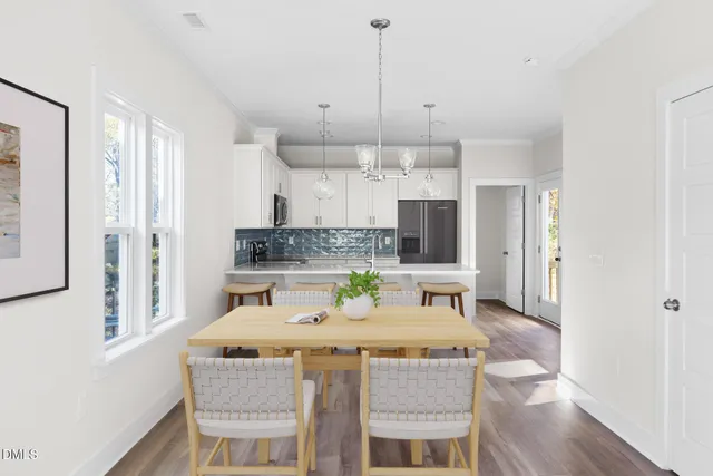 a kitchen with kitchen island granite countertop a sink a center island and cabinets