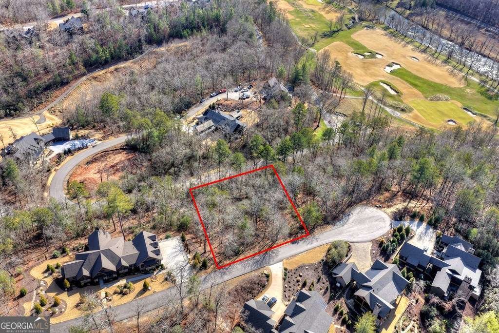 112 Fawn Way Mineral Bluff, GA 30559 - Photo 6 of 26 an aerial view of a house with a yard and mountain view in back