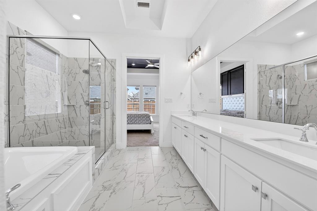 1314 Yellow Pne Road Celina, TX 75009 - Photo 23 of 40 a spacious bathroom with a shower sink double and mirror