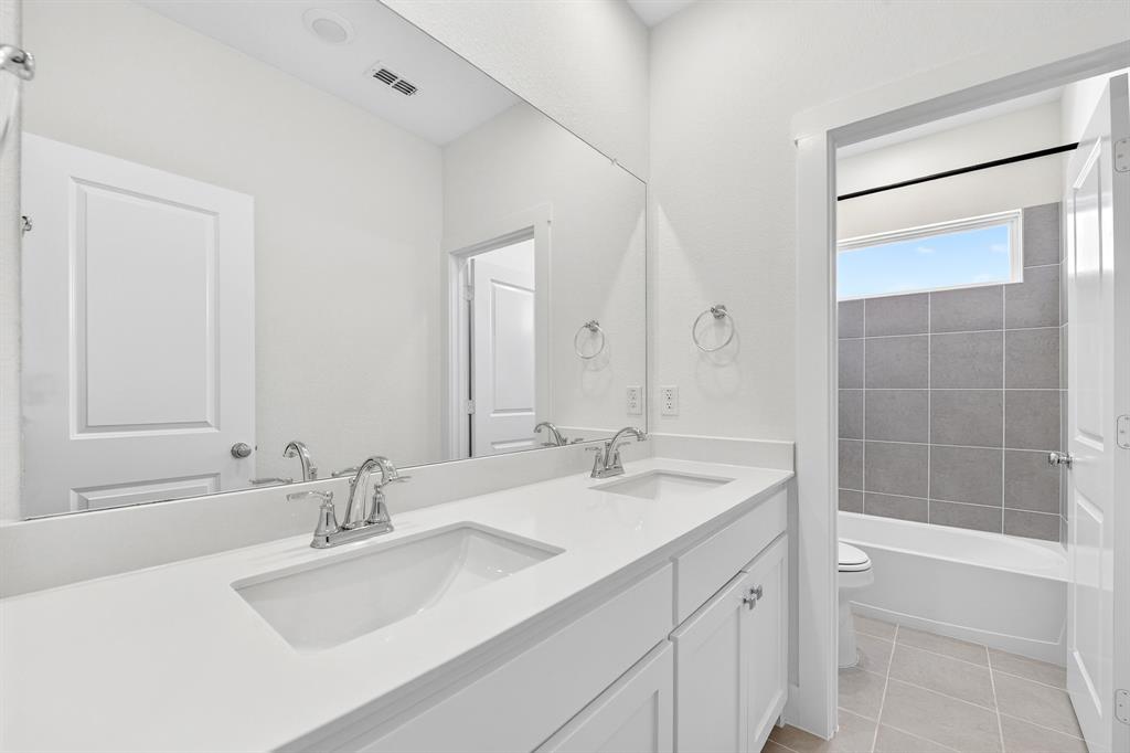 1314 Yellow Pne Road Celina, TX 75009 - Photo 33 of 40 a bathroom with a sink double vanity and a shower