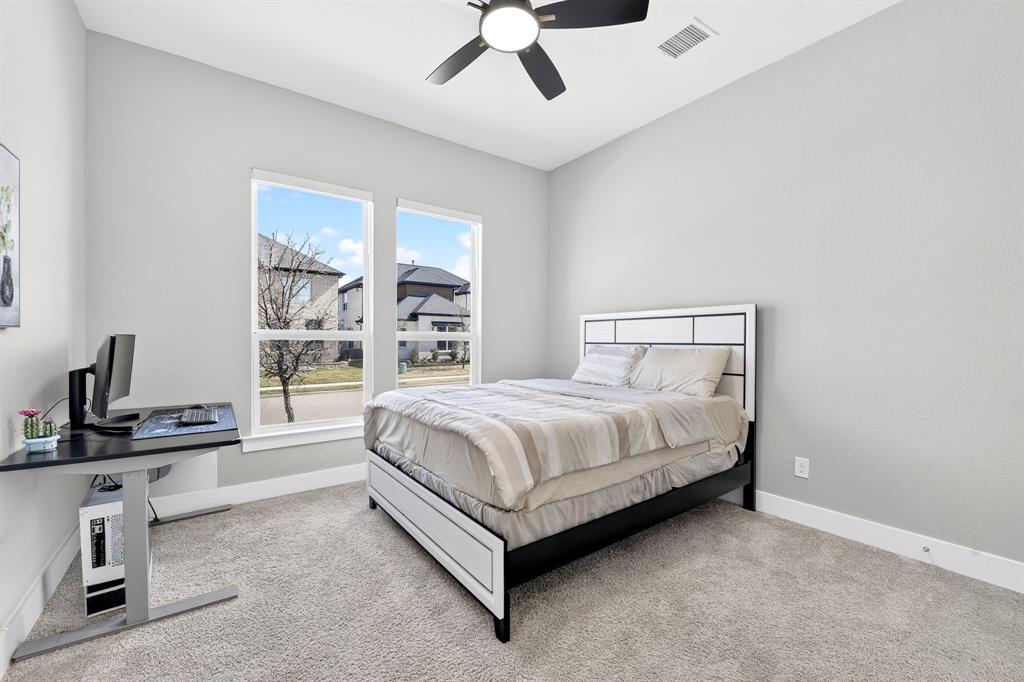 1314 Yellow Pne Road Celina, TX 75009 - Photo 8 of 40 a spacious bedroom with a bed and a window