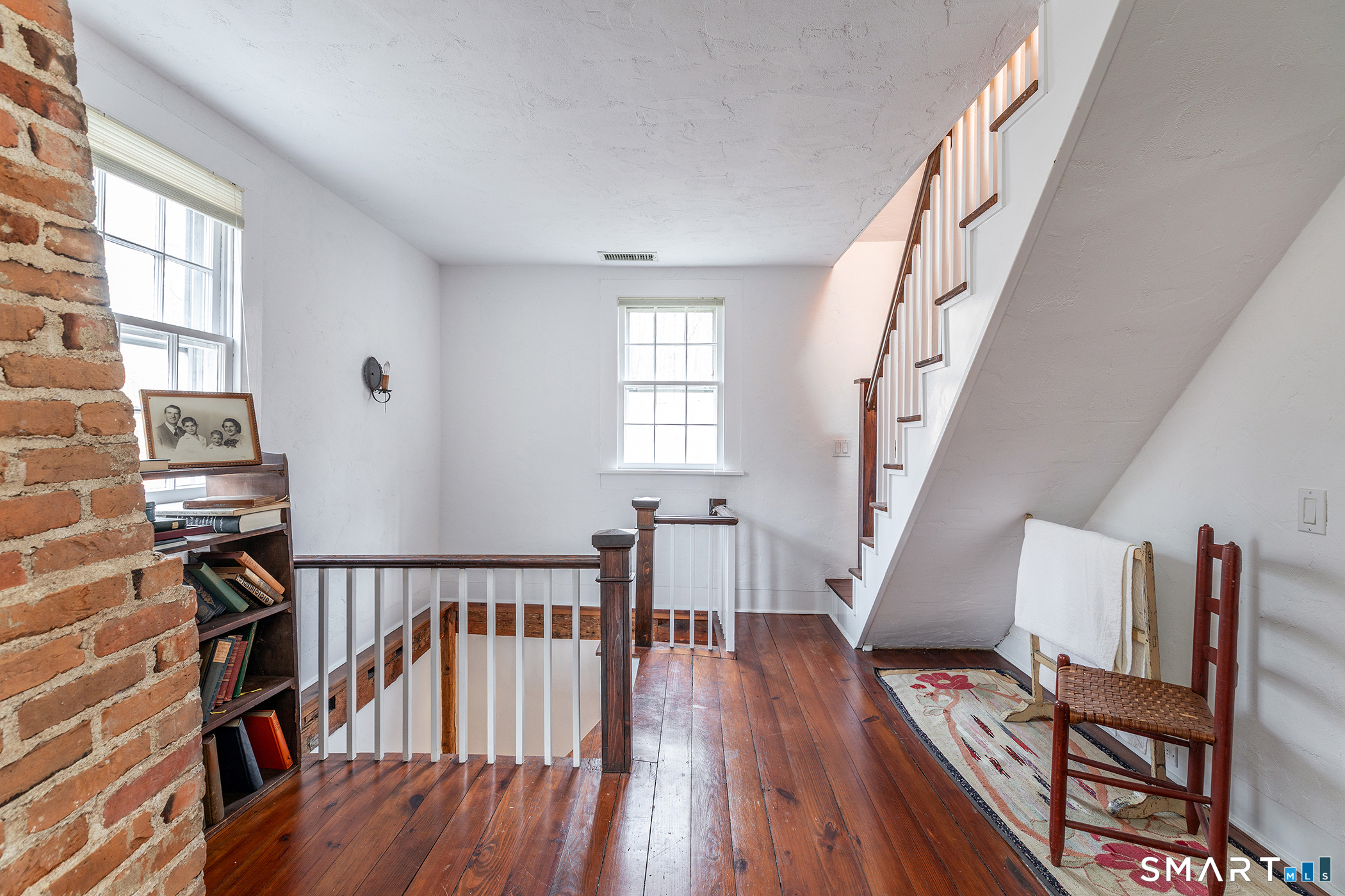 197 Skyline Ridge Road Bridgewater, CT 06752 - Photo 23 of 31 a view of a livingroom with furniture and staircase
