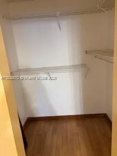 a view of swimming pool with a yard and mountain view in back