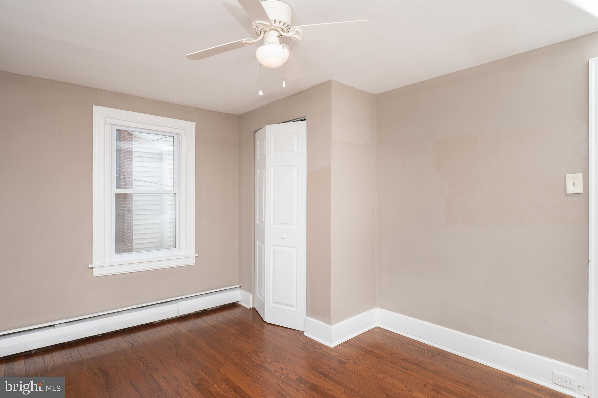 308 Summer St Road Royersford, PA 19468 - Photo 10 of 25 an empty room with wooden floor and windows