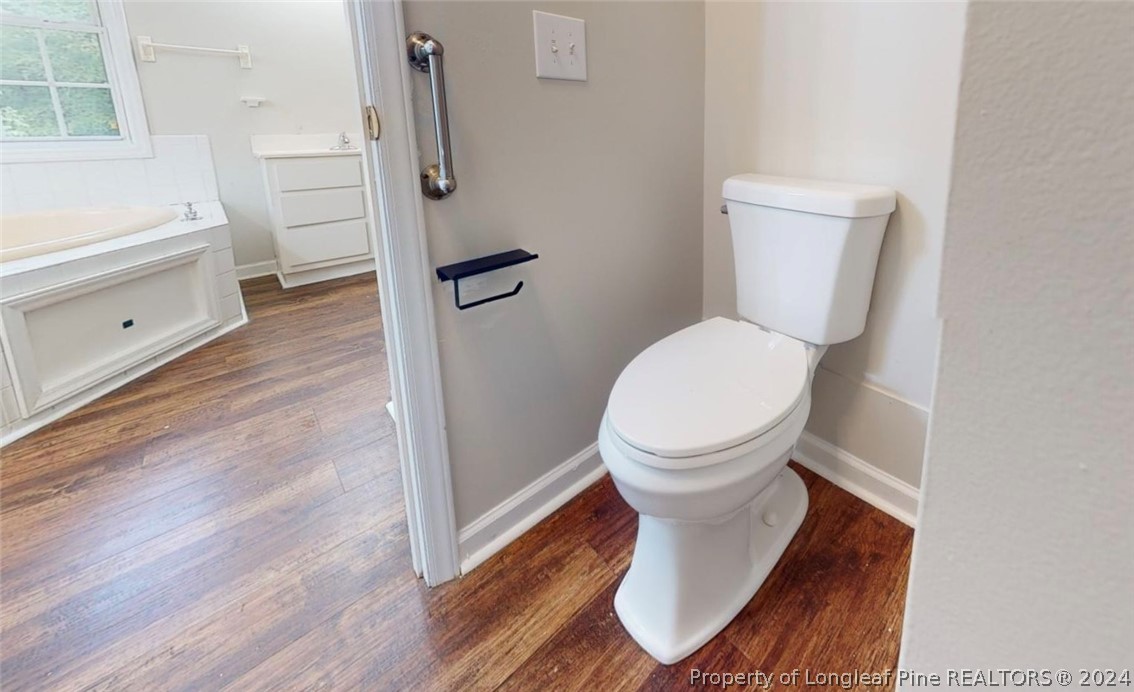 1340 Roseland Road Aberdeen, NC 28315 - Photo 17 of 39 a bathroom with a toilet and a shower