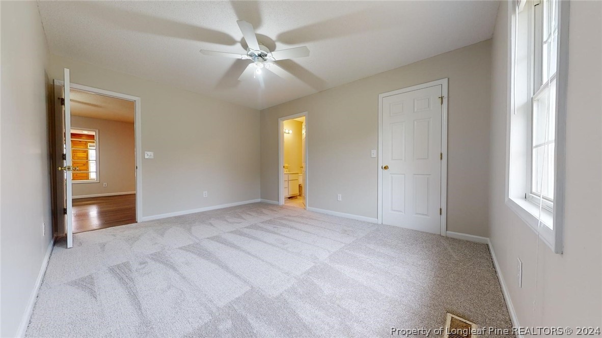 1340 Roseland Road Aberdeen, NC 28315 - Photo 26 of 39 a view of an empty room with a window